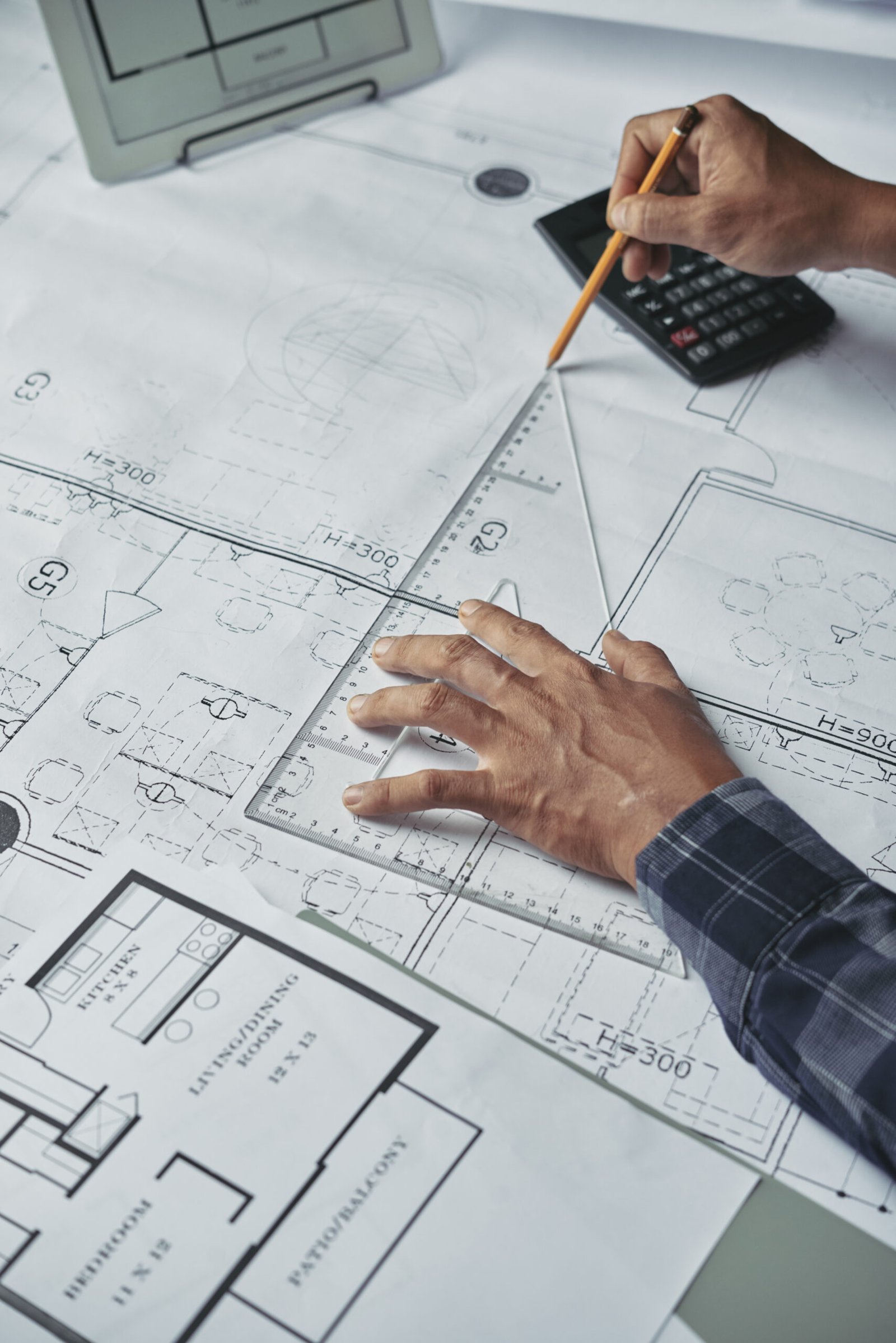 Designing new house Hands of architect drawing blueprint of the house